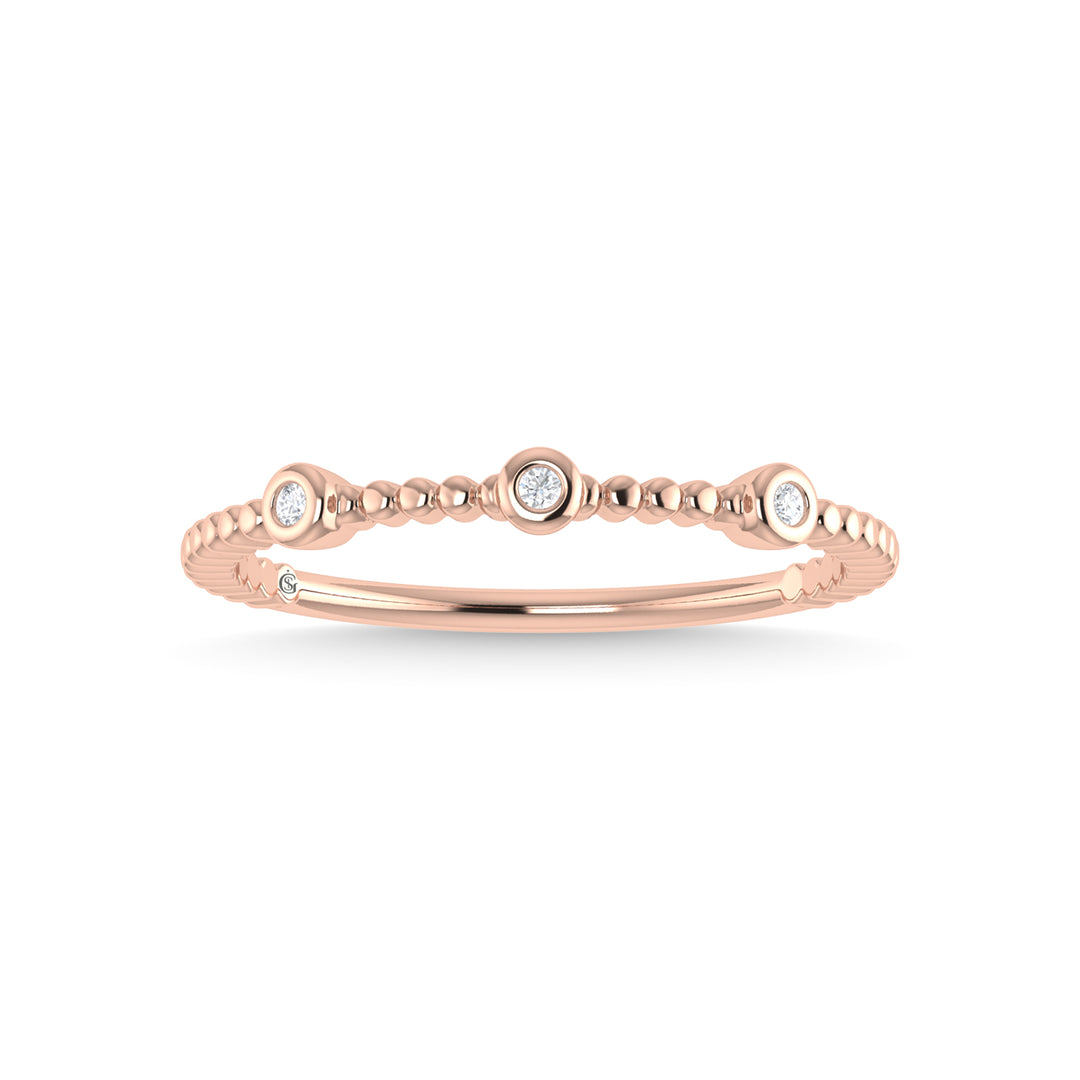 Diamante en oro rosa de 14 quilates de 1/20 quilates total. Banda apilable