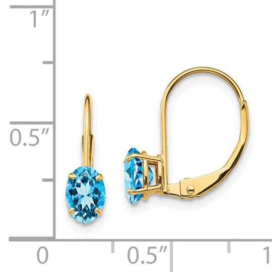Pendientes de Oro Amarillo de 14k con Topacio Azul Suizo Ovalado de 6x4mm y Cierre LeverBack